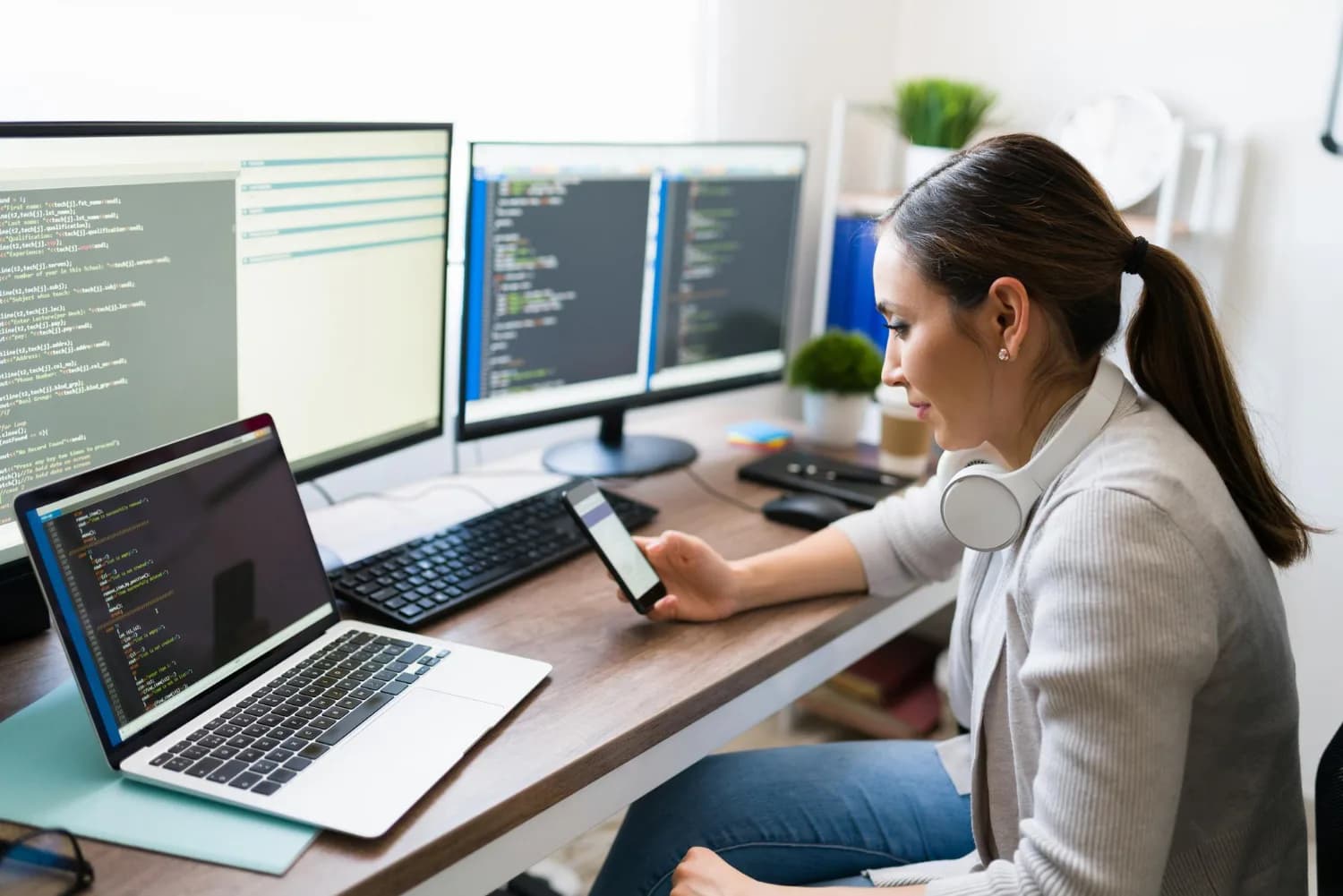IT professional managing software work across multiple screens